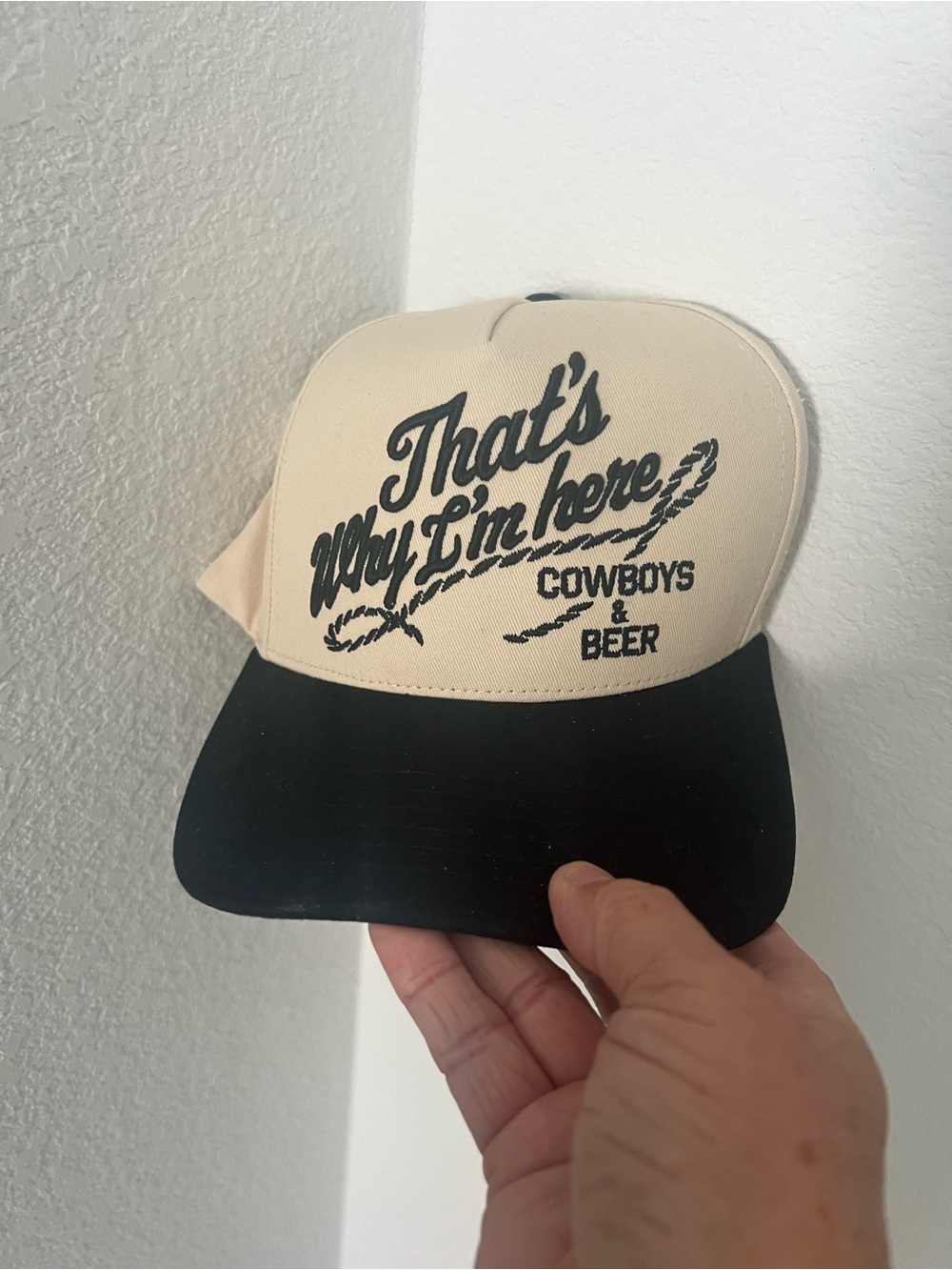 C.C Beige and Black Trucker Hat with "That's Why I'm Here" Graphic
